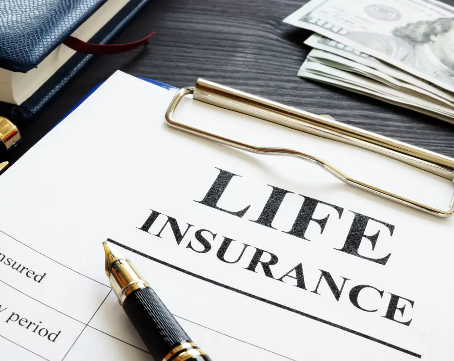 Life insurance document with pen and money.
